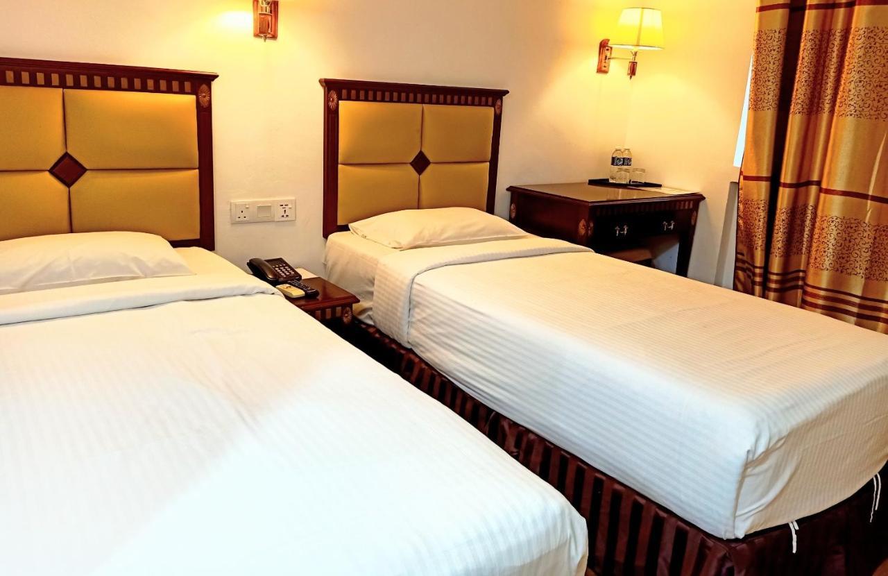 Super Oyo 90464 Borneo Suites Hotel Кота-Кинабалу Экстерьер фото