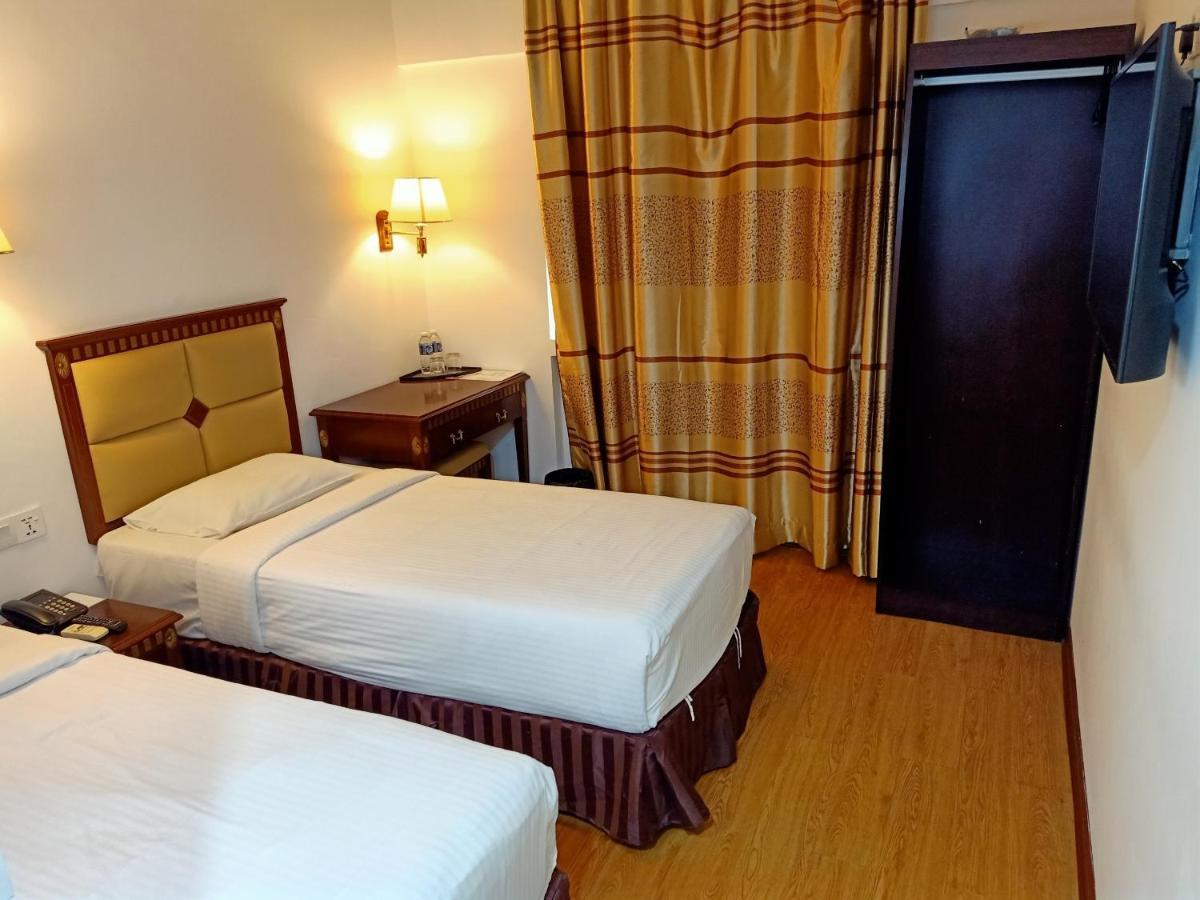 Super Oyo 90464 Borneo Suites Hotel Кота-Кинабалу Экстерьер фото