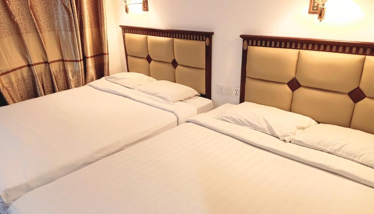 Super Oyo 90464 Borneo Suites Hotel Кота-Кинабалу Экстерьер фото