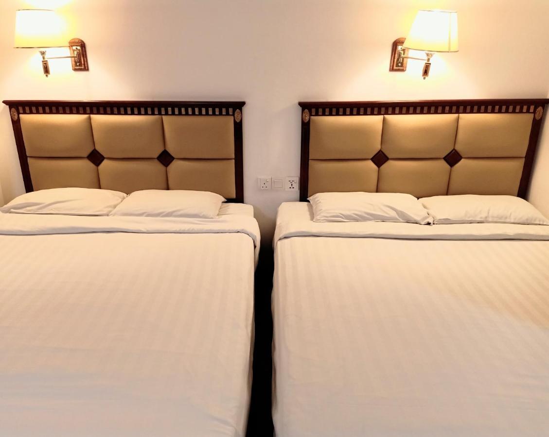 Super Oyo 90464 Borneo Suites Hotel Кота-Кинабалу Экстерьер фото