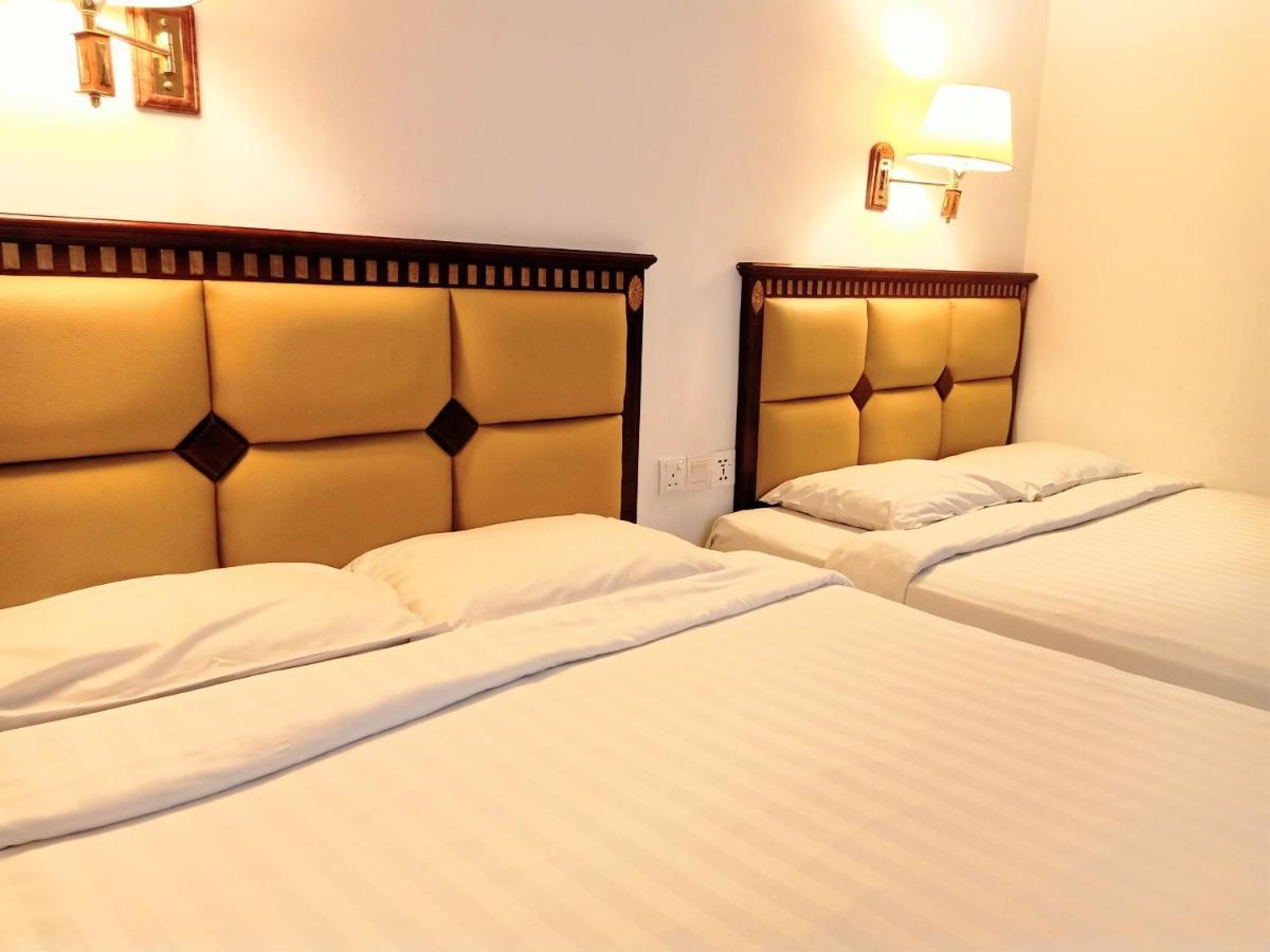 Super Oyo 90464 Borneo Suites Hotel Кота-Кинабалу Экстерьер фото